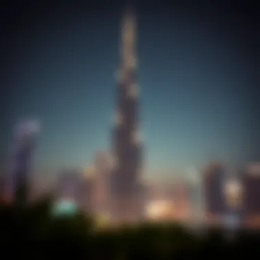 Night view of the Festival Tower illuminated against the Dubai skyline