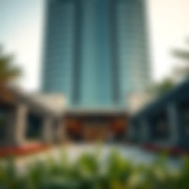 Ground-level view of the entrance to Maryah Tower with surrounding landscaping